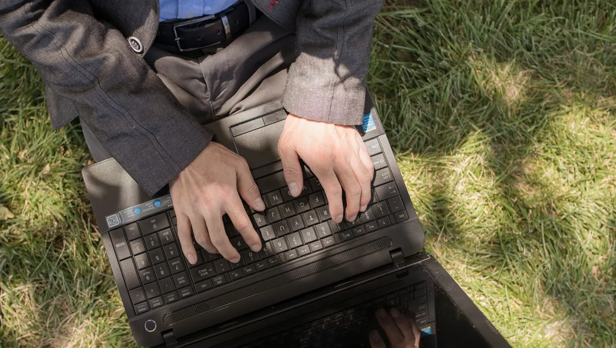 Developer fixing a website on a laptop