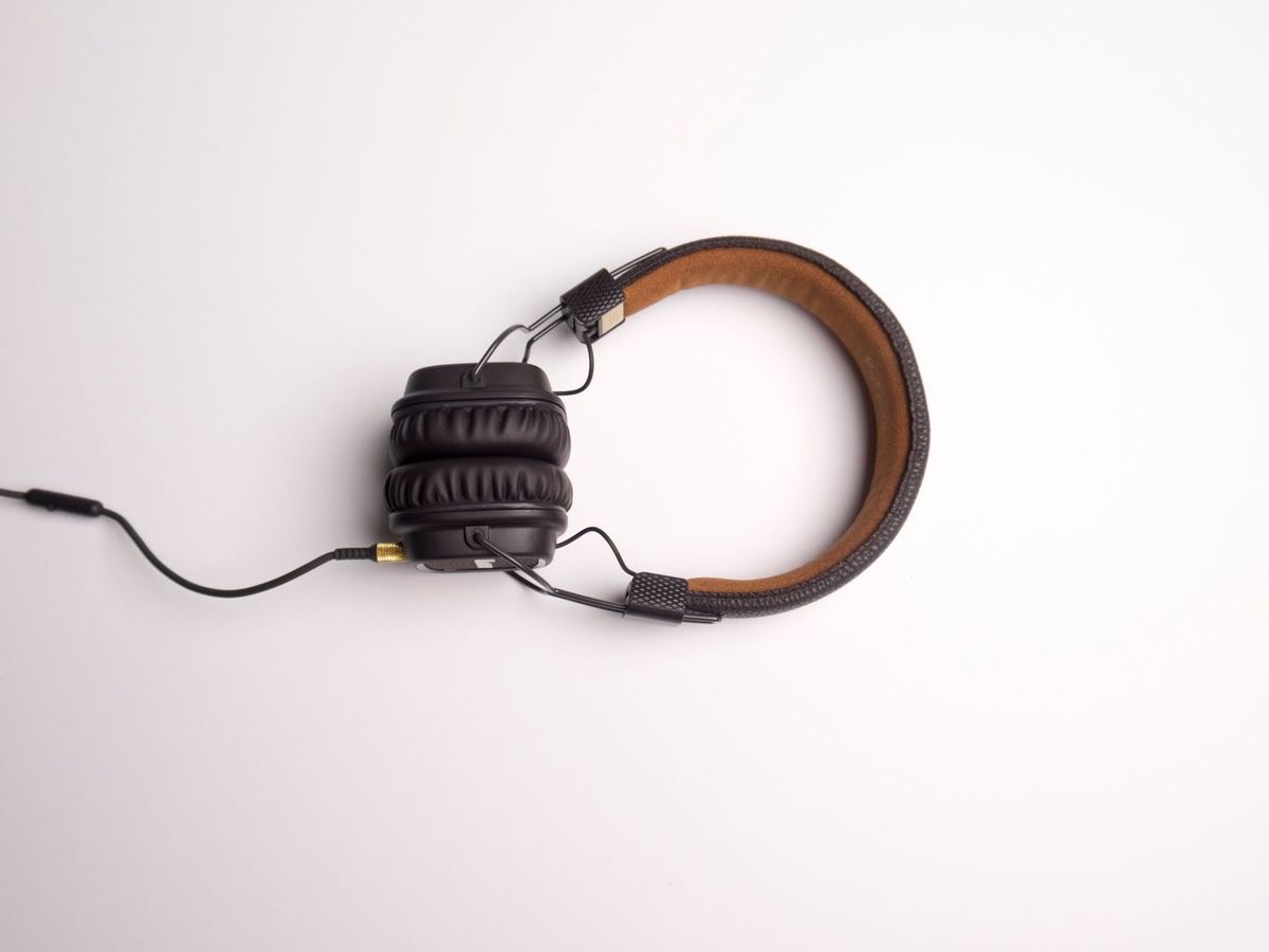 Person with headphones using a computer