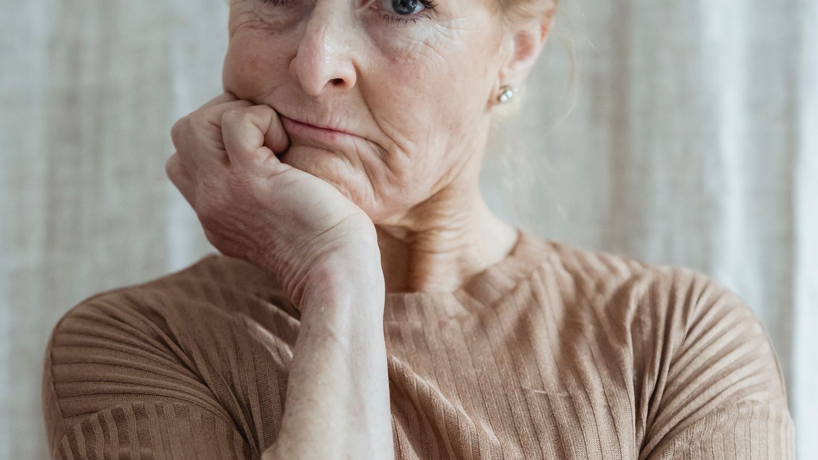 Older person reading large text on a tablet