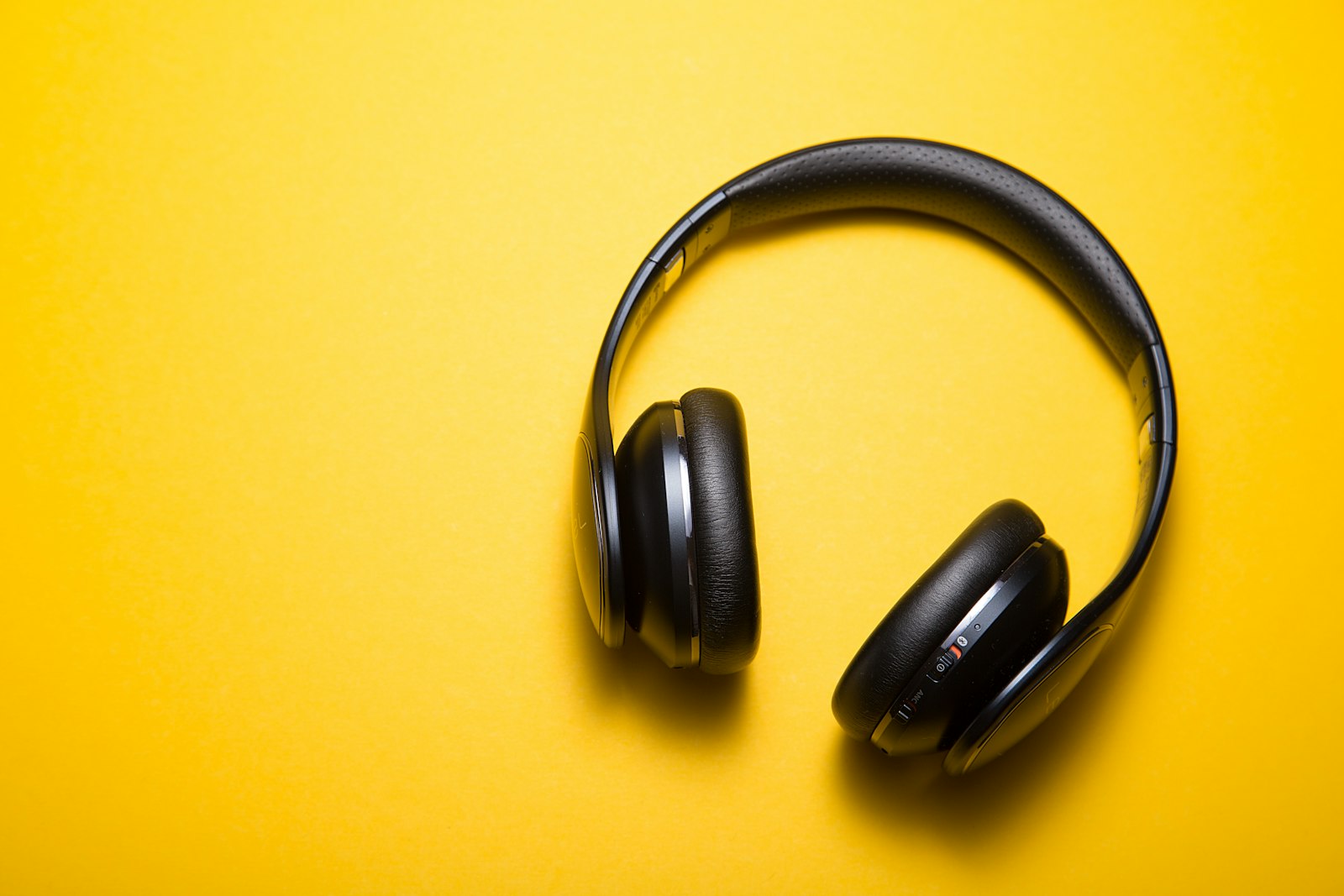 Second person checking audio recordings with headphones