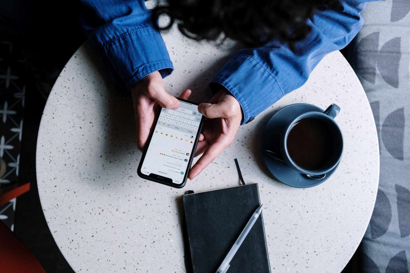 Person typing chat messages on a phone for a conversation task