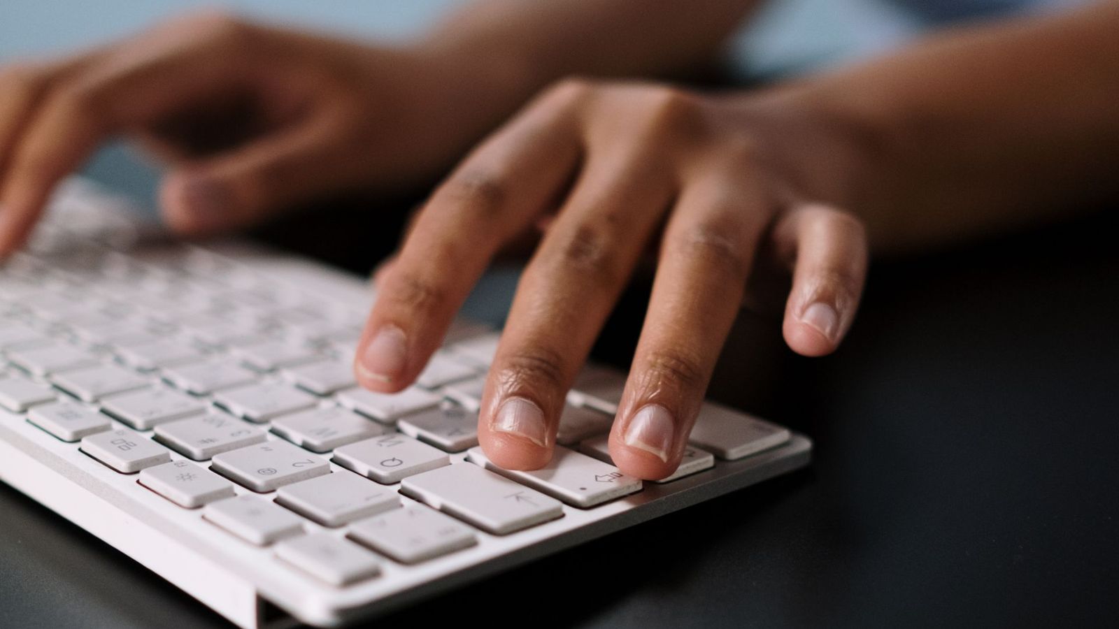 Person filling in a form on a laptop
