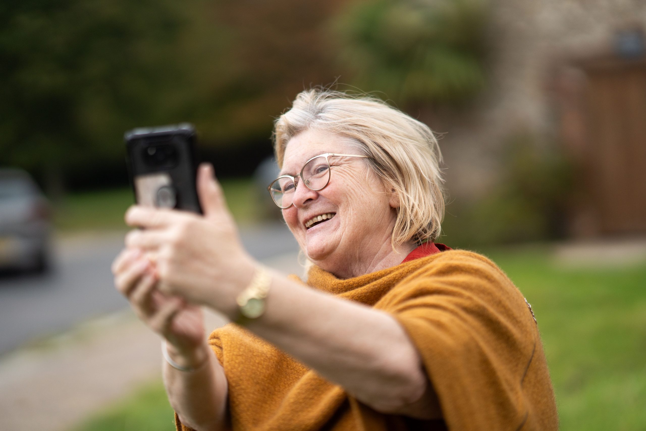Adult taking a selfie with a smartphone