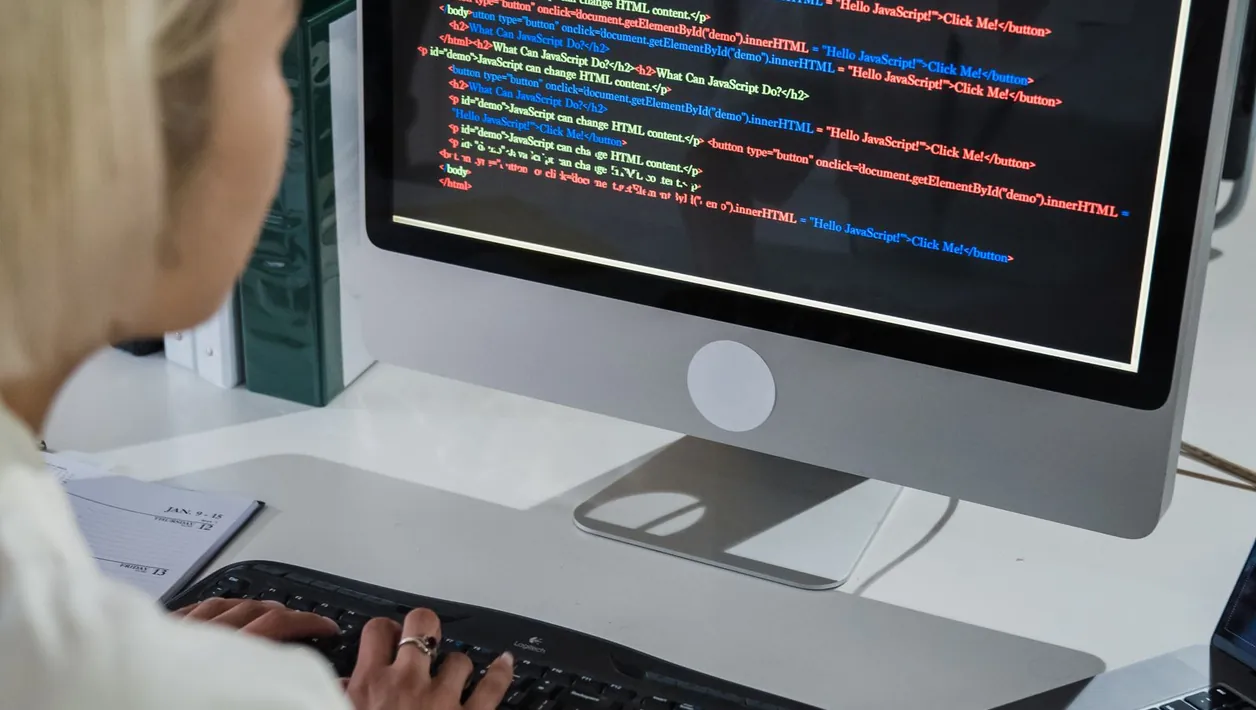 Developer watching gameplay on a monitor