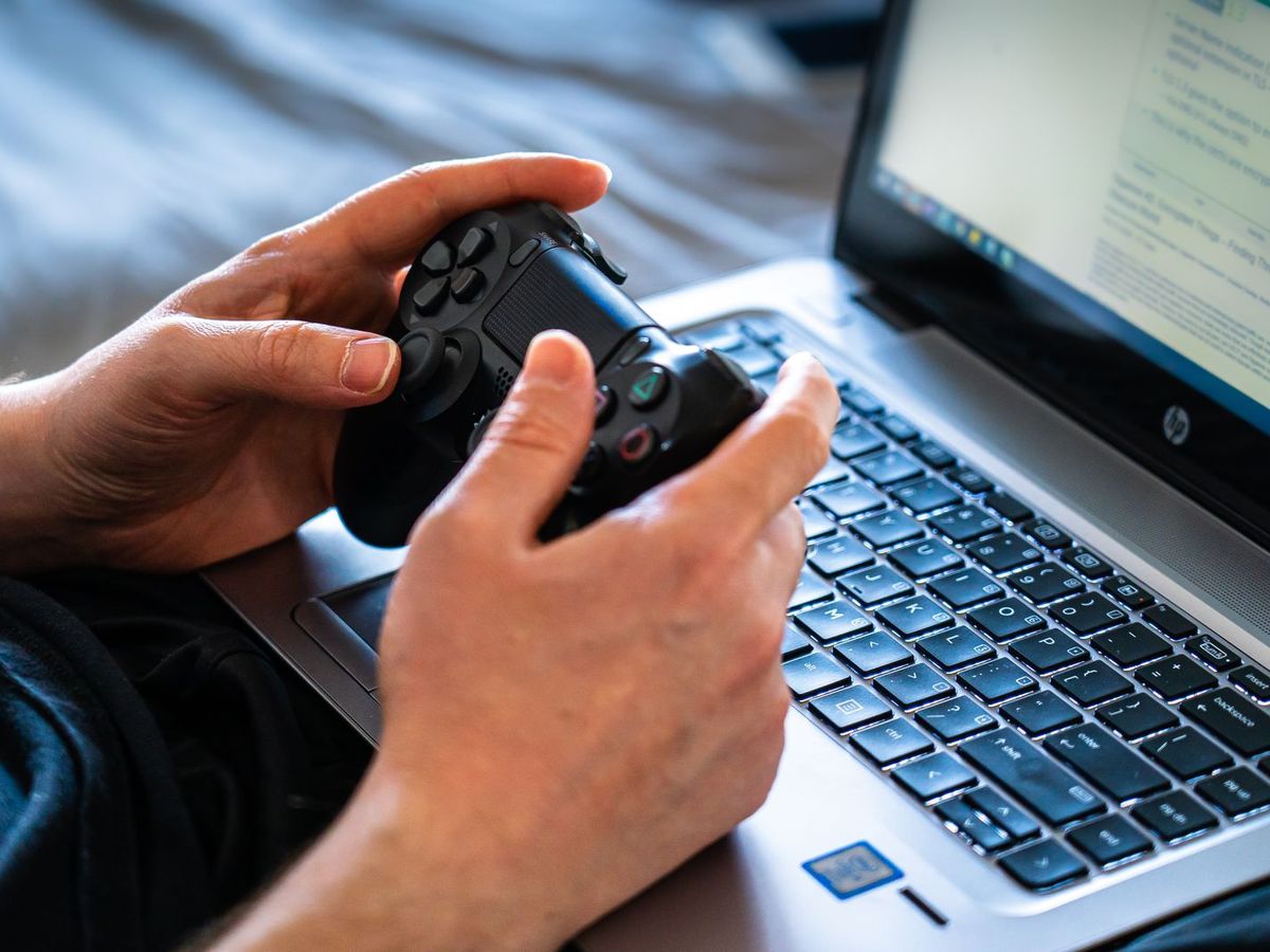 Player testing a game on a laptop