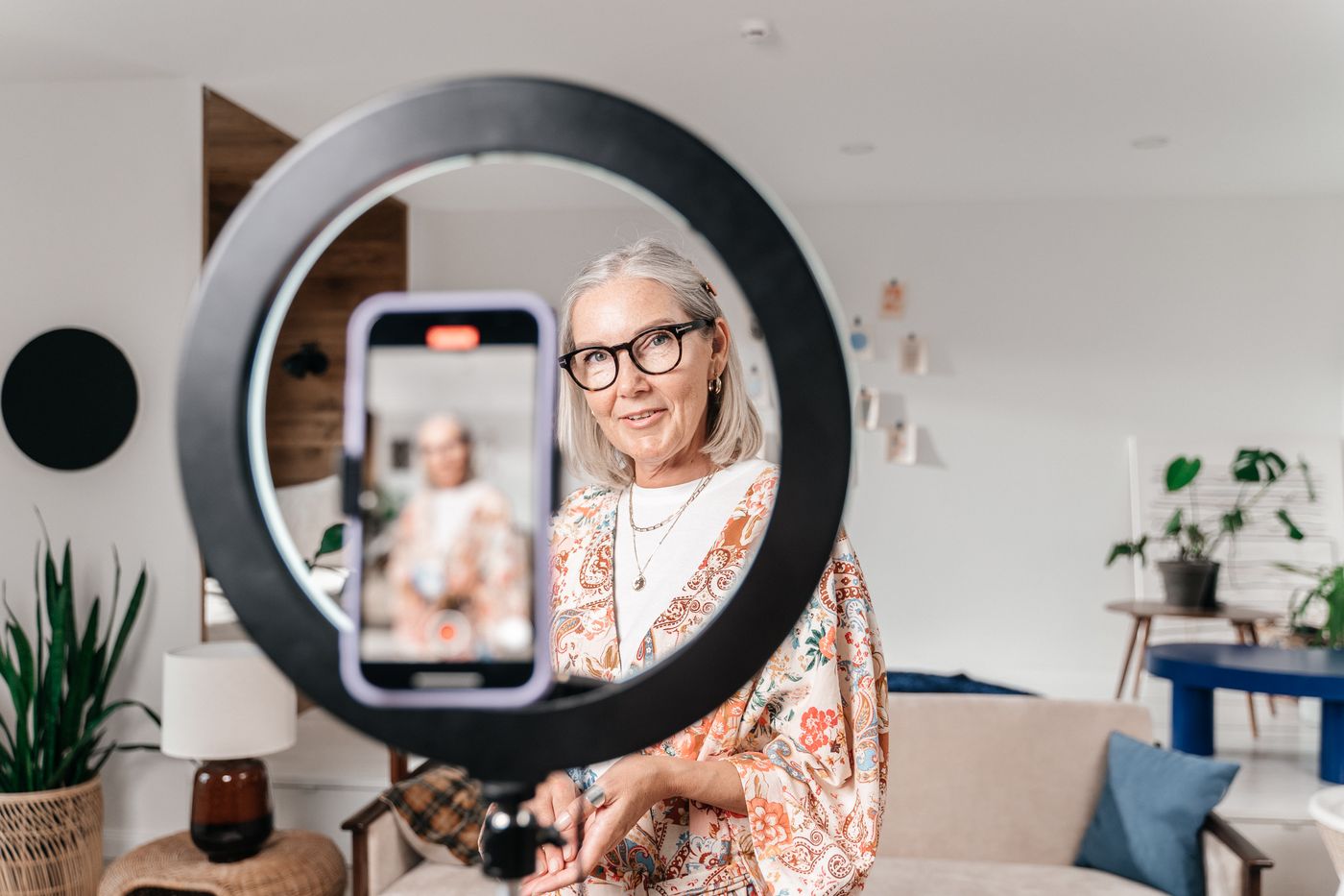 Person recording a short video at home with a smartphone