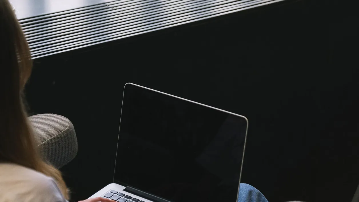 Person preparing a list of screens to check