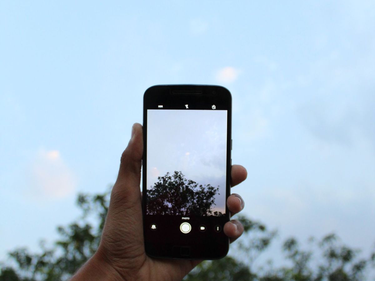 Person taking a screenshot on a phone