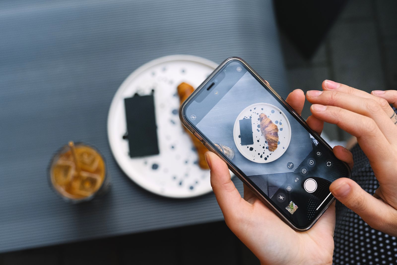 Person photographing an item with a smartphone