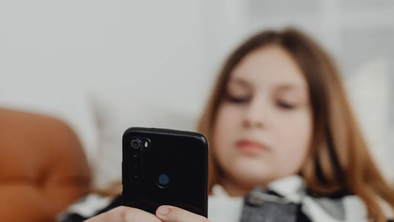 Woman signing up for an app on her smartphone
