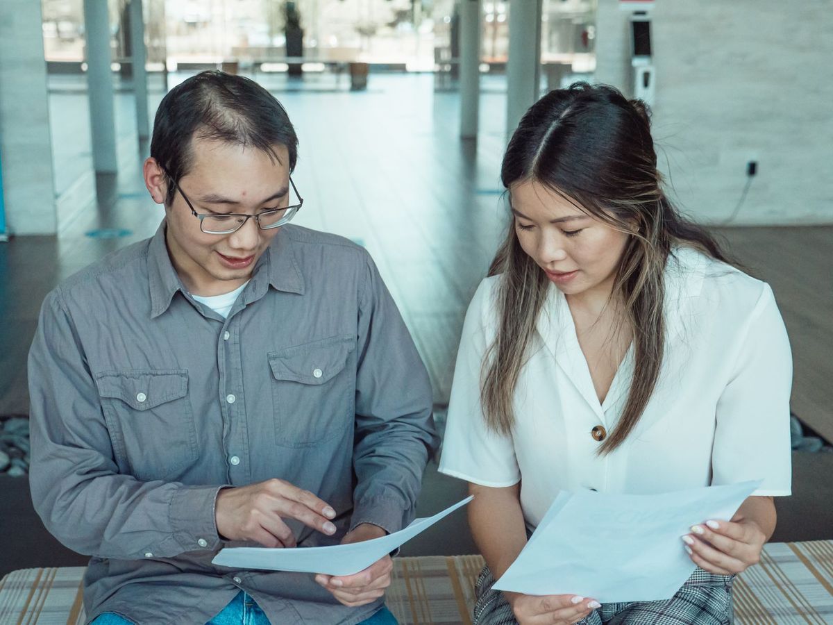 Team comparing results on a screen