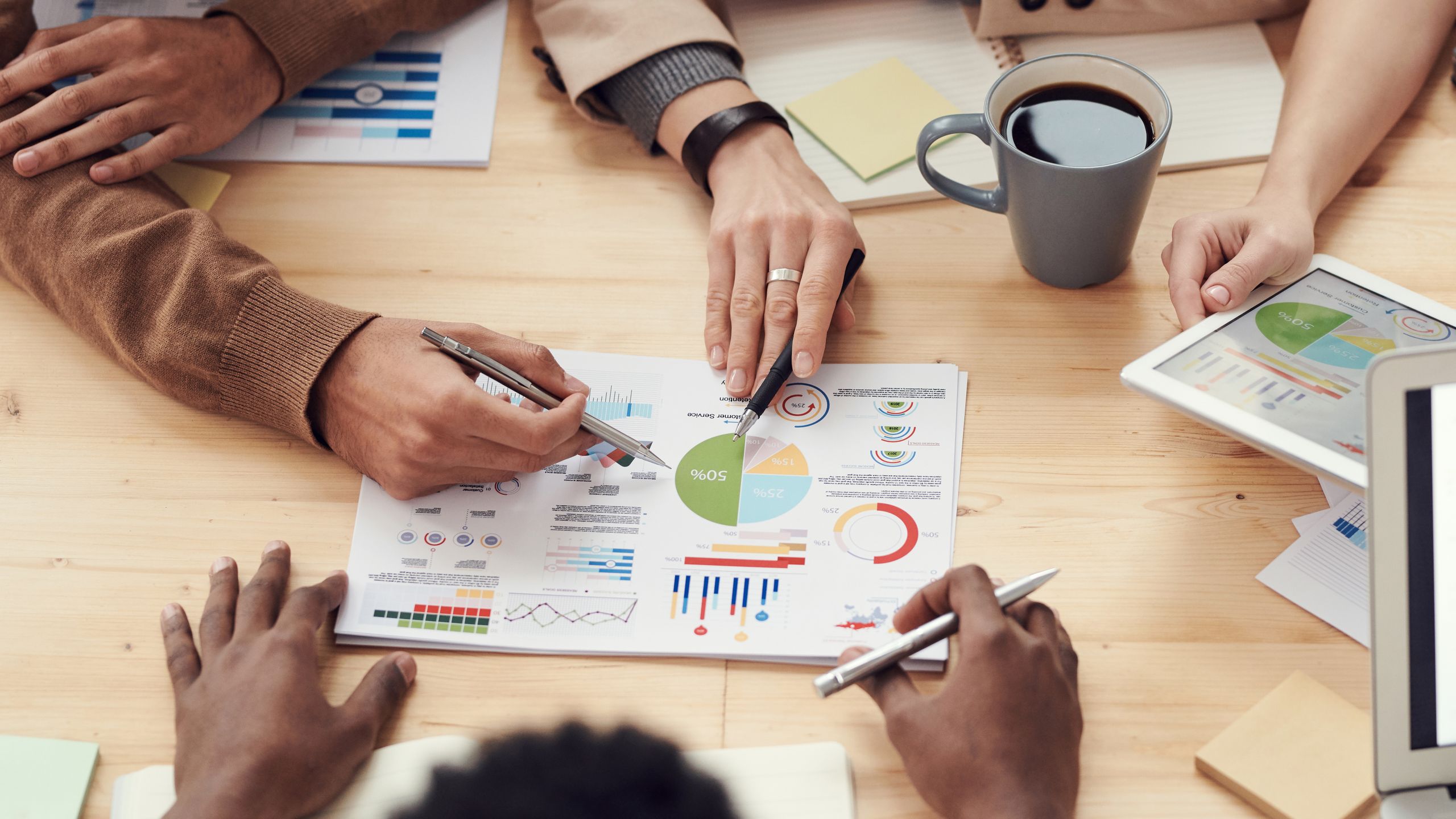 Diverse professionals collaborating around a table in a modern office