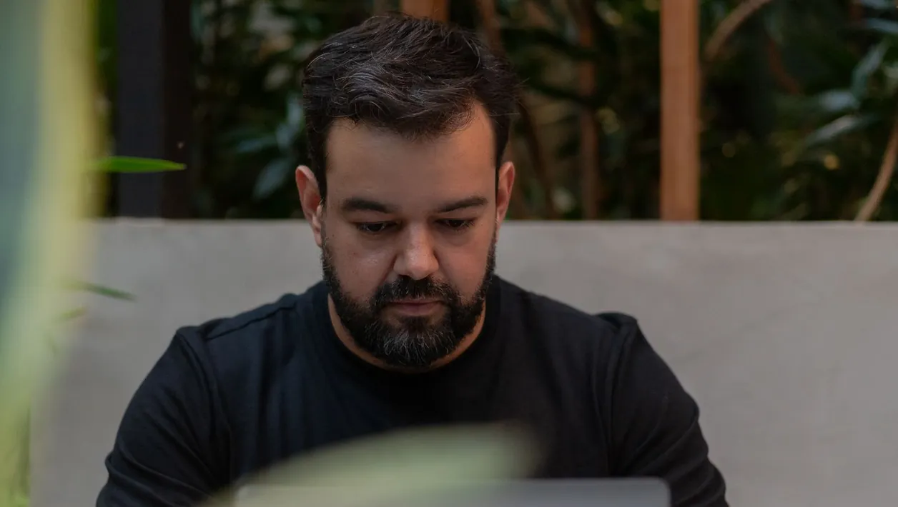 Man reviewing a screen recording on his laptop