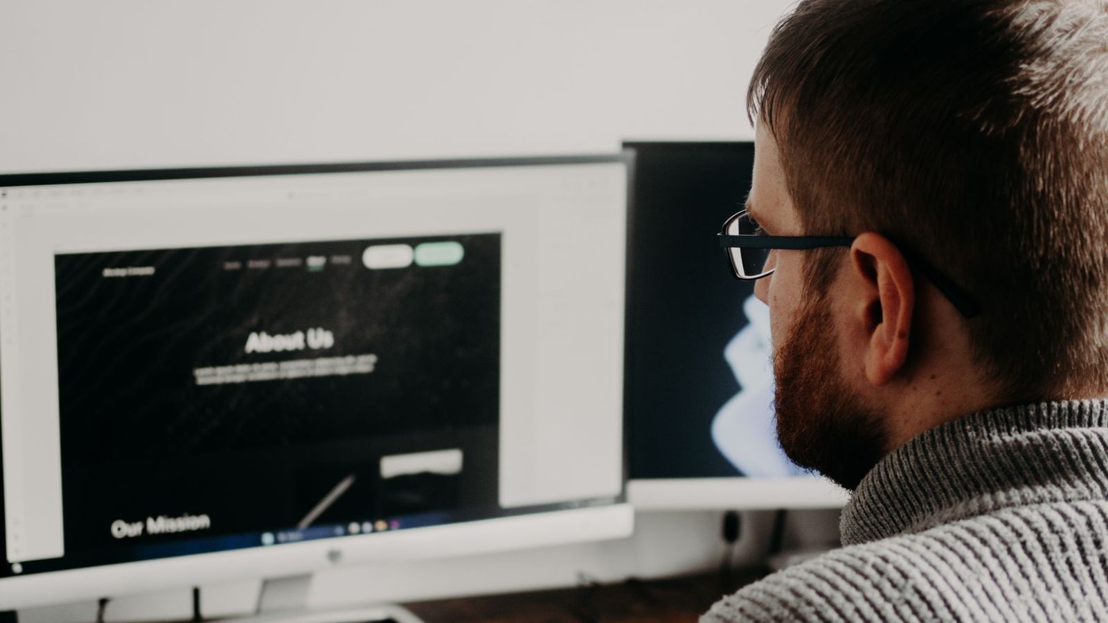 Two people comparing designs on a screen
