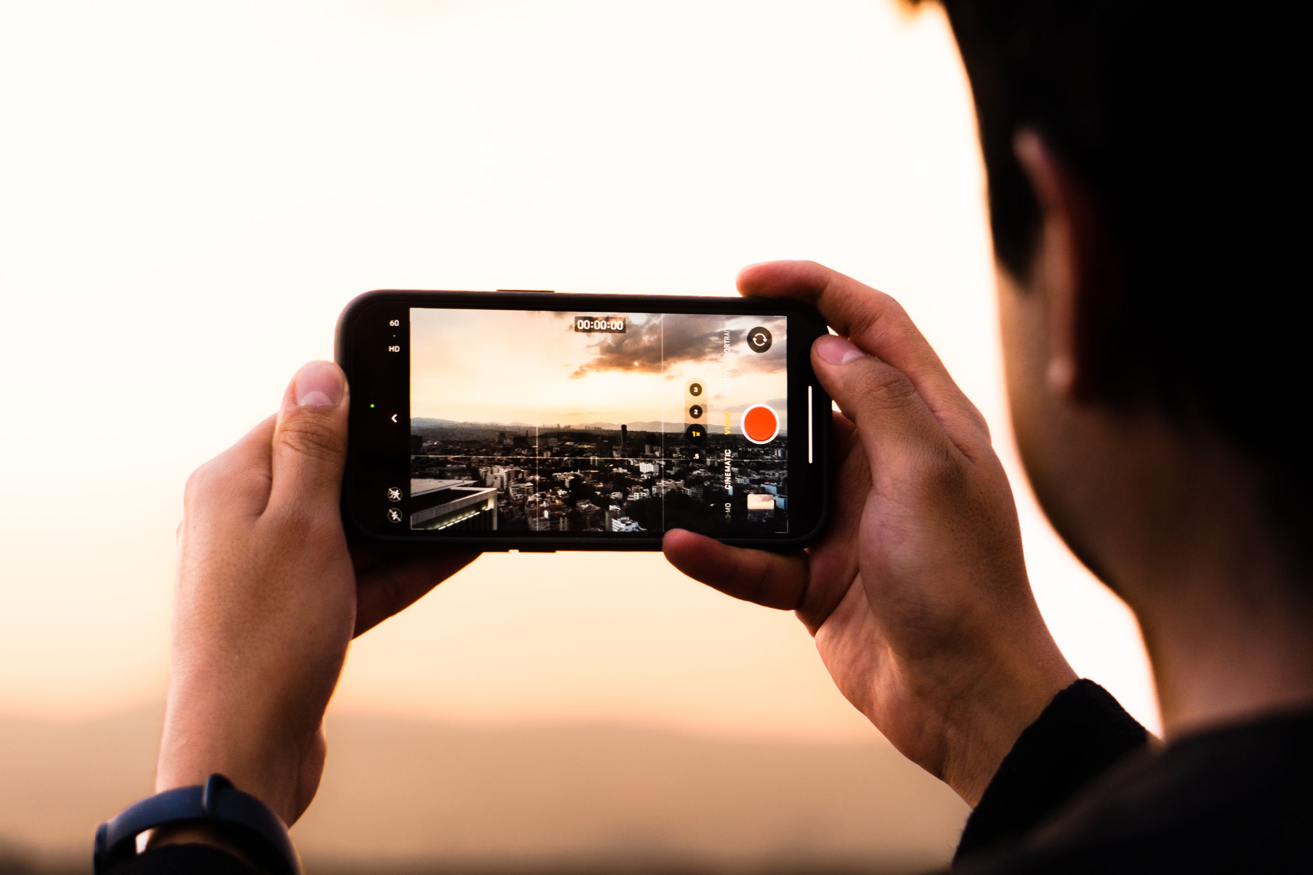 Person filming a video with a smartphone