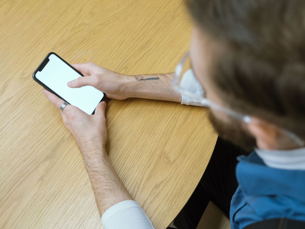 Person taking a screenshot on a phone